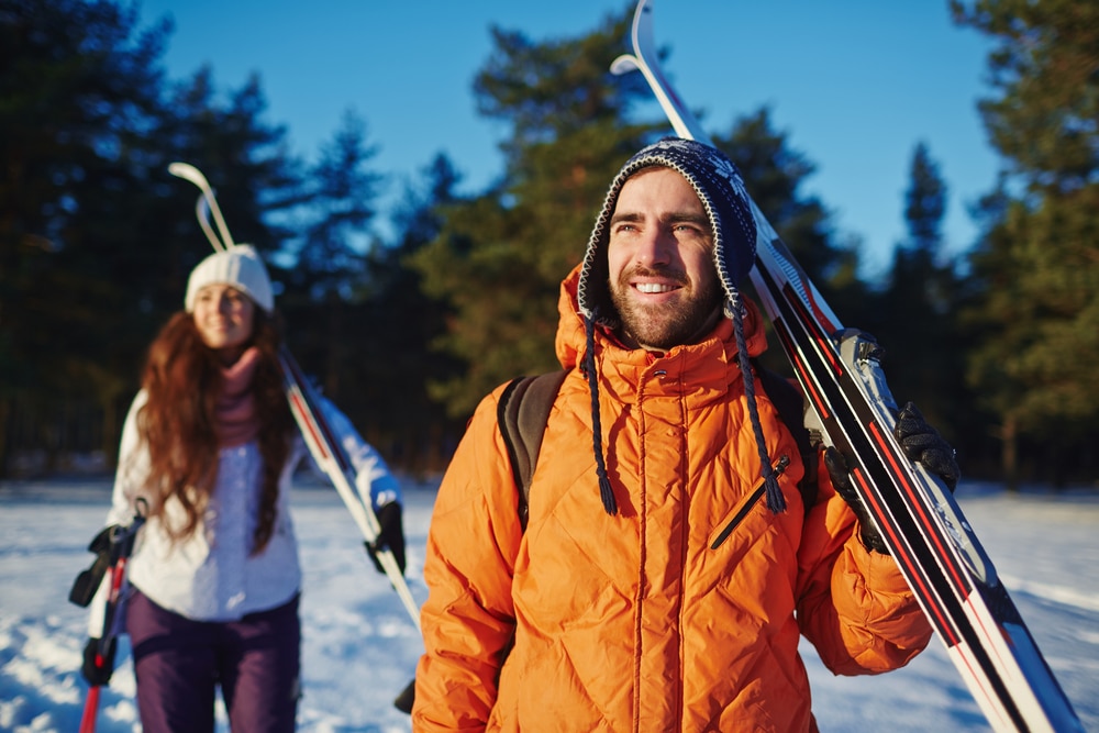 Young Couple getting ready to go cross country skiing at Blueberry Lake Near our Vermont Bed and Breakfast