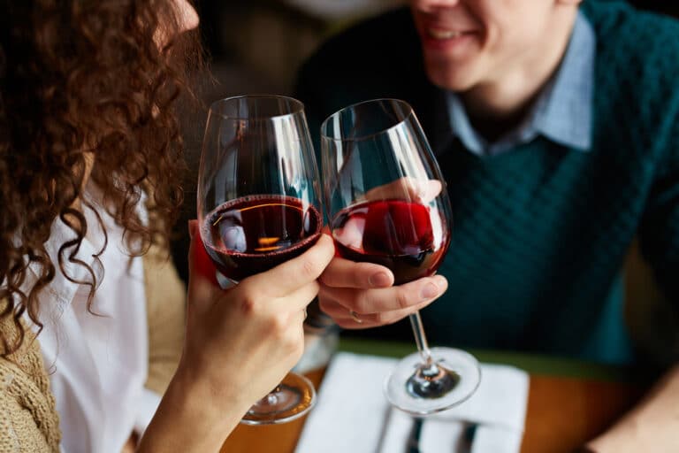 Waitsfield, VT Restaurants, photo of a happy couple toasting with red wine at dinner