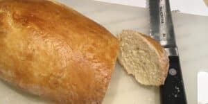 Loaf and slice of freshly baked bread.