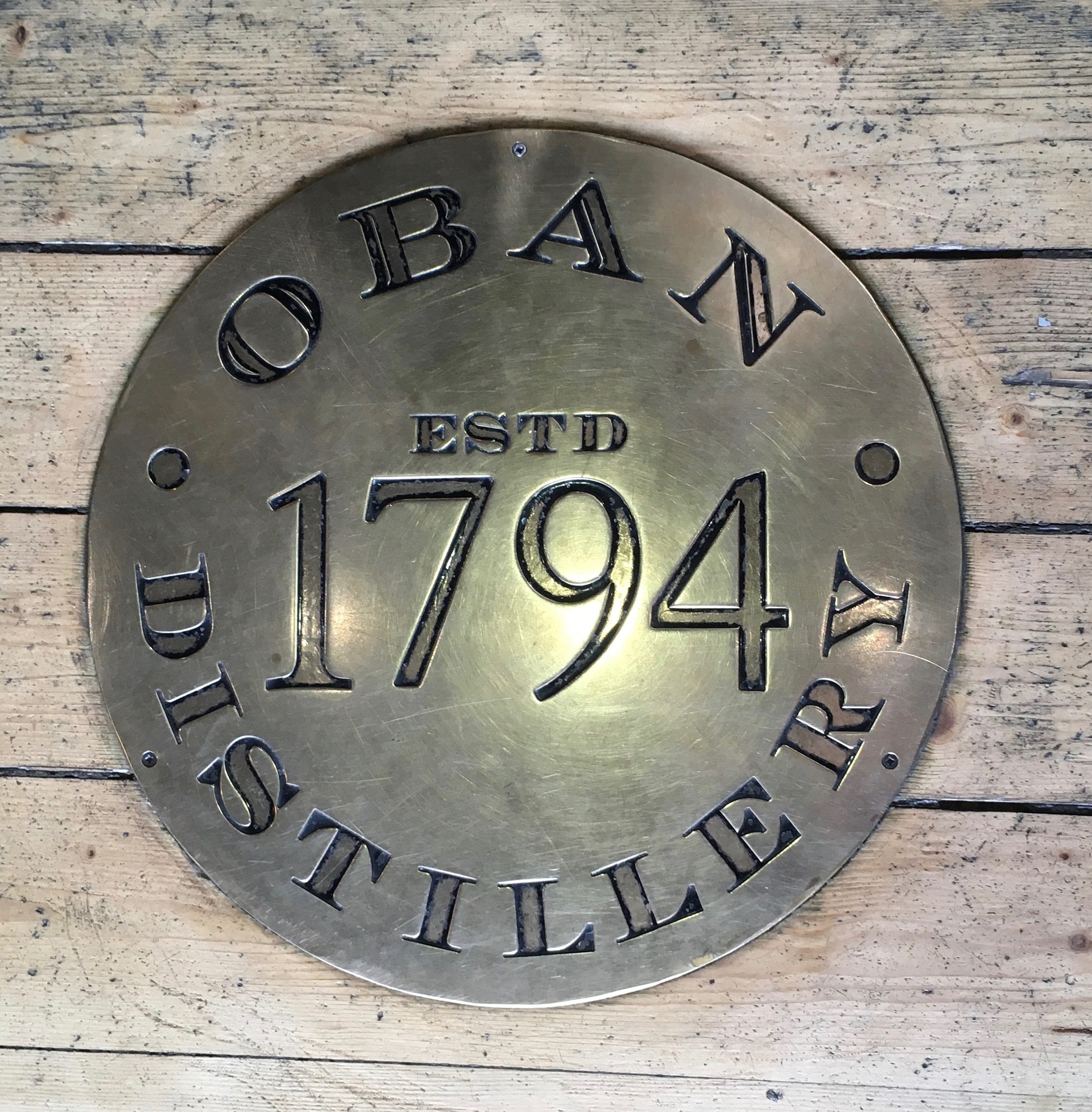 Oban distillery plaque noting the whisky name and 1794 date of establishment.